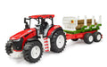 Tracteur Roadmax avec remorque à billots de bois