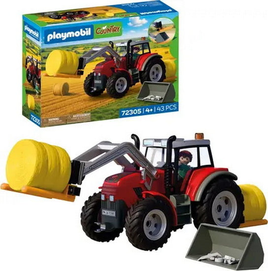 Grand tracteur avec bottes de foin